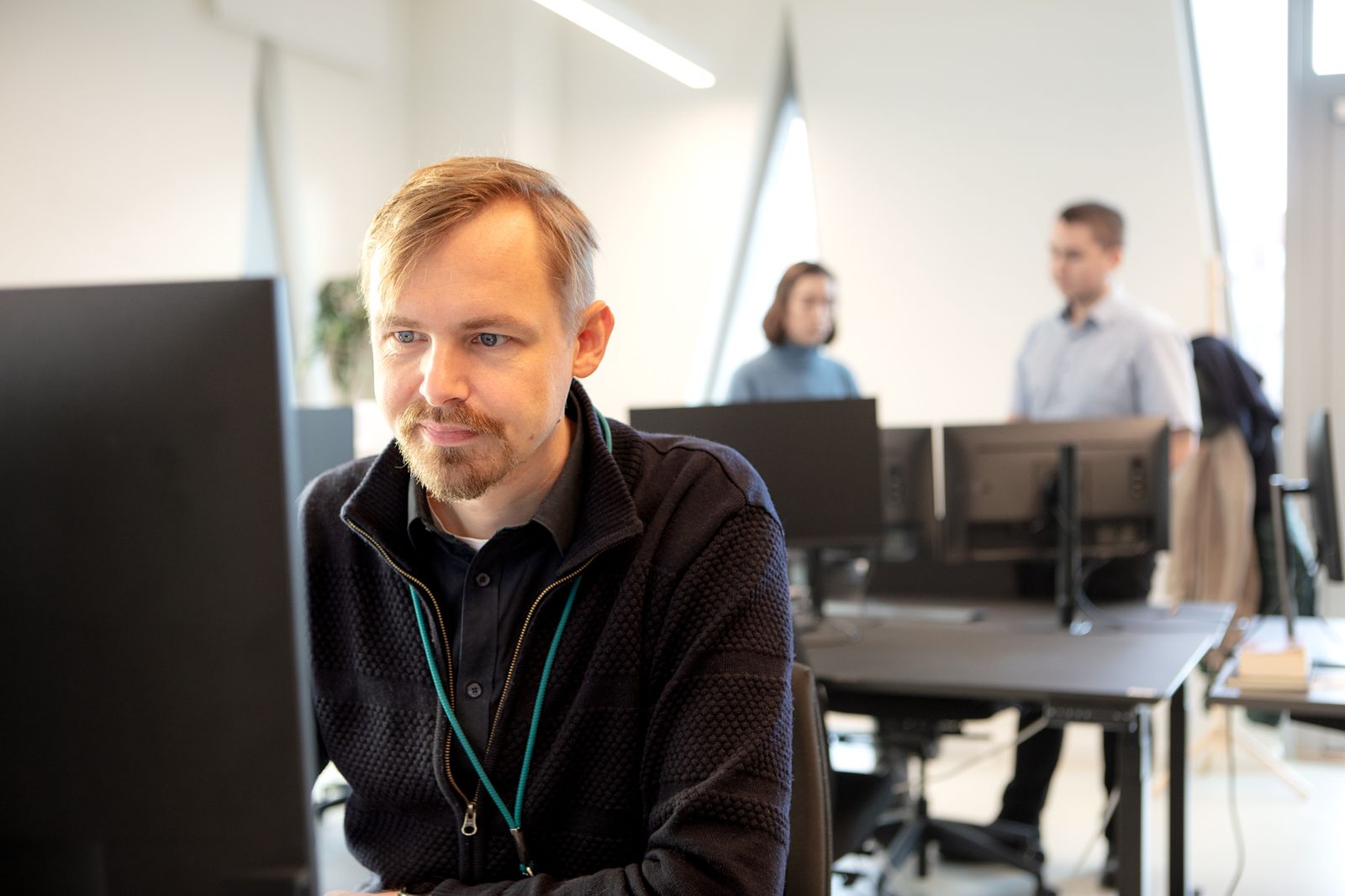 Prenaital team member working at a computer in the office